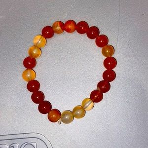 I make crystal bracelets and sell them this one is a multicolored jade bracelet